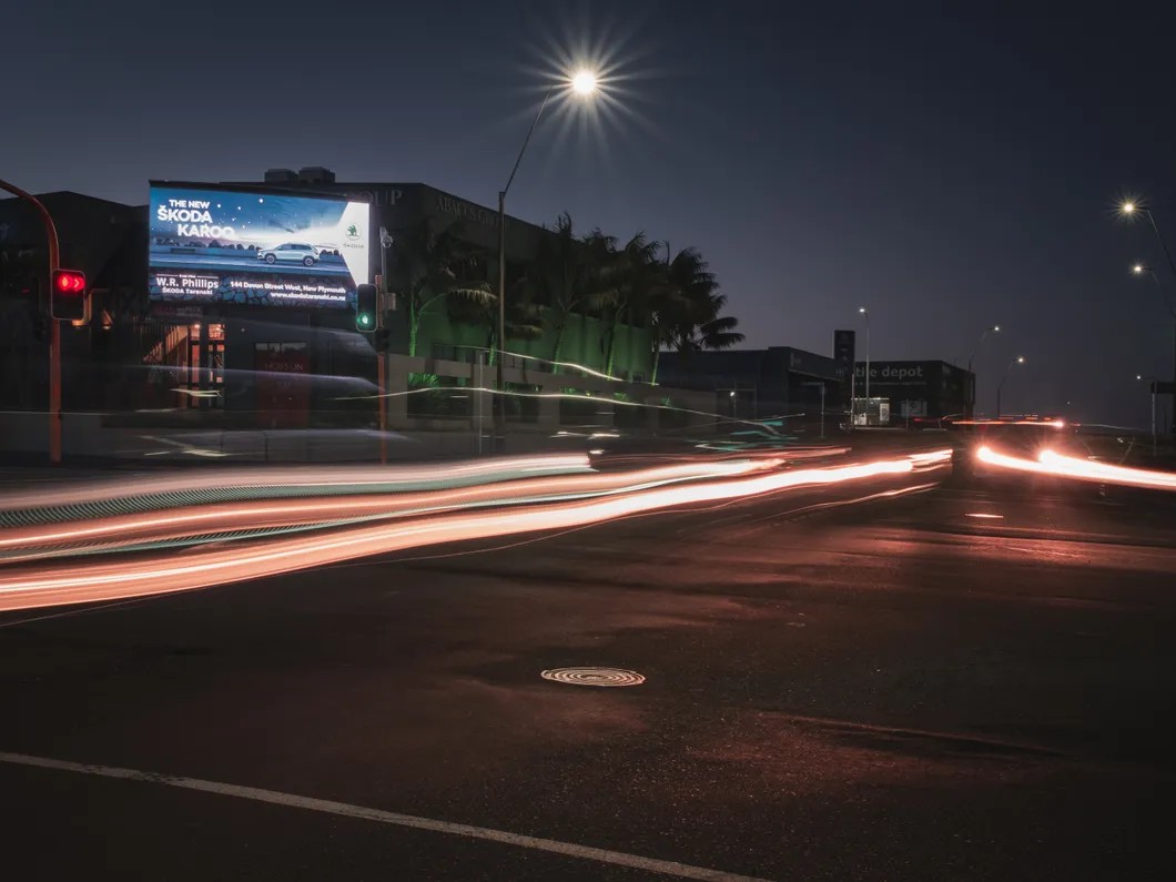 Night time photo of Digital billboard on the corner of Hobson & Devon Streets.